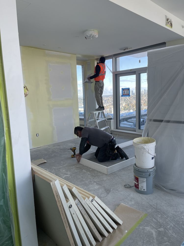 Interior painting crew working in a Surrey, BC high-rise for Top Shine Painting Ltd.